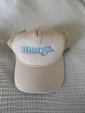 margs. Embroidered Trucker Hat in Beige with Light Blue Logo